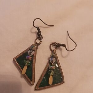 Handmade Dark Green glass earrings with brass-like edges.